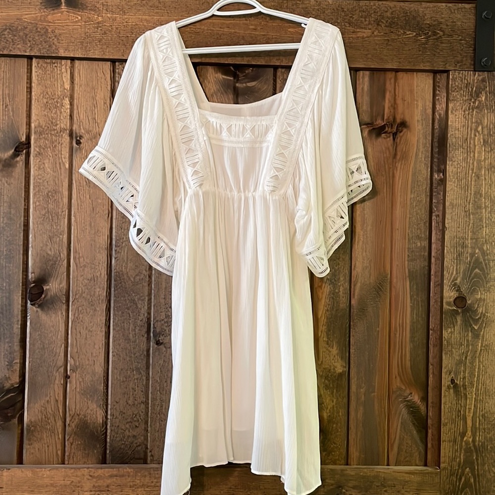 White babydoll dress with laser cut sleeve detail